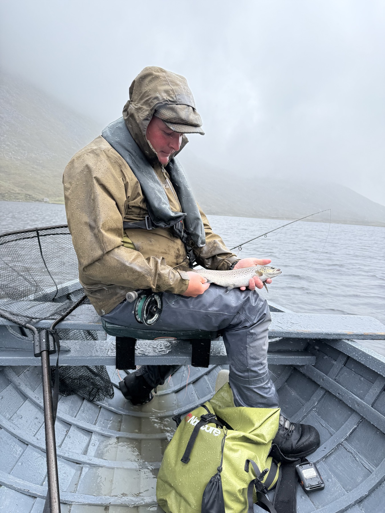 Brown trout from the boat in the rain