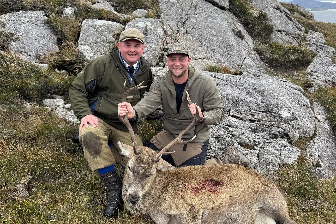 Ryan and Rex with a Highland red stag