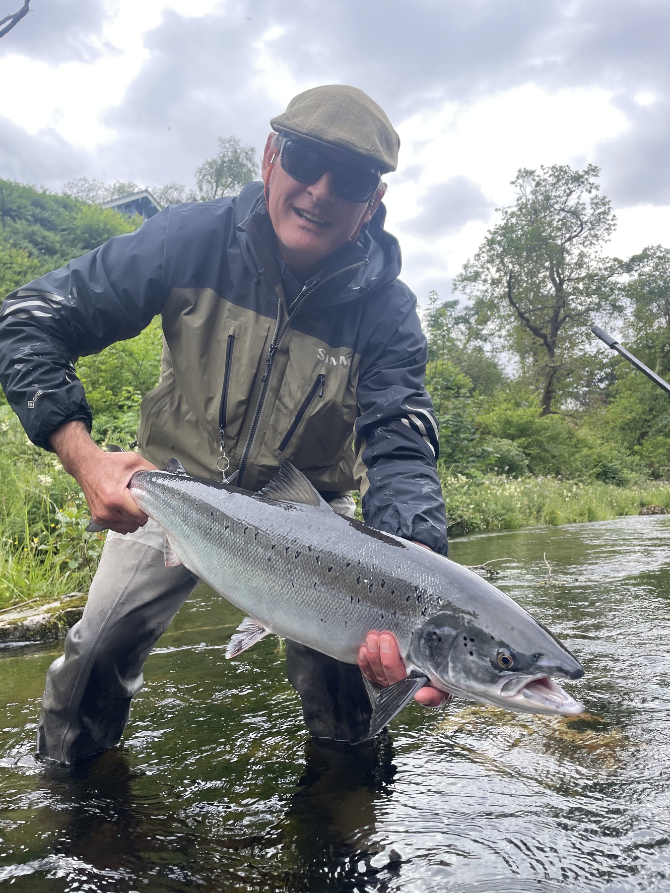 Angler with a fresh-run Atlantic salmon