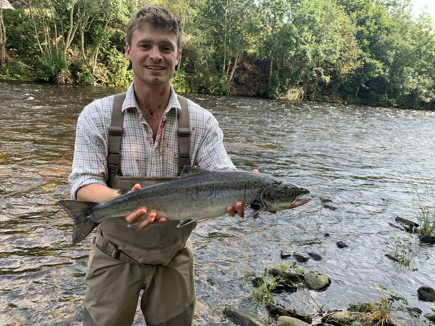 Young angler with an Atlantic salmon